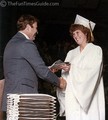 Graduate receiving her diploma.
