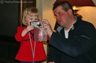 Karly wanted to be the first to use Daddy's new digital camera!